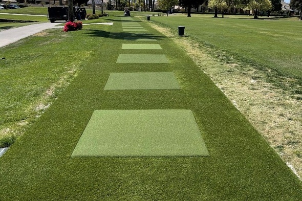 Metro New York Outdoor tee line with light green synthetic grass boxes inside a dark green synthetic grass strip